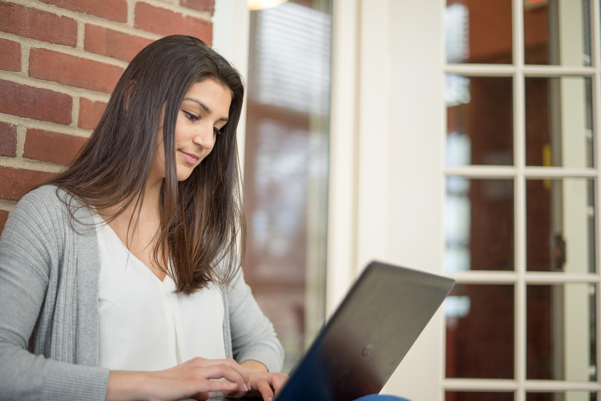 Student looking at laptop